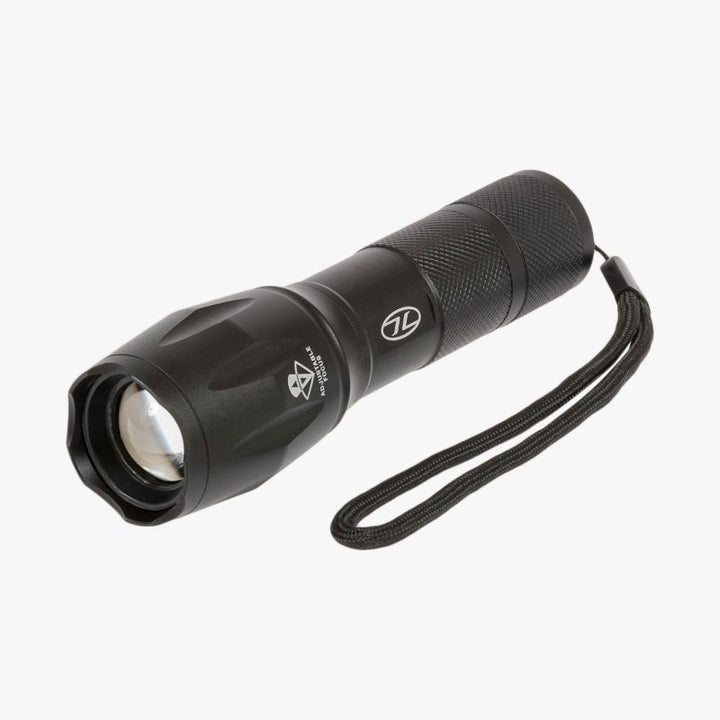 front and rear of orion torch. black aluminium case with white highlander logo and wrist strap. contoured lens case to change zoom. rear orange button