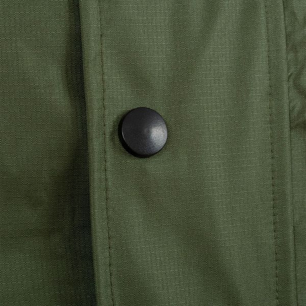 olive ab-tex gore-tex. black press stud on green fabric