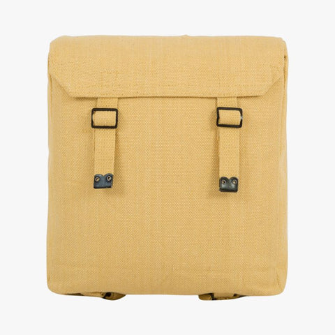 beige web backpack rear shoulder strap and 2 front fastening vertical straps through black buckle. Lid covers top